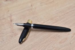 A Sheaffer Statesman snorkel fill fountain pen in black with broad band to white spot cap having