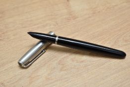 A Parker 51 aerometric fill fountain pen in black with a brushed steel cap