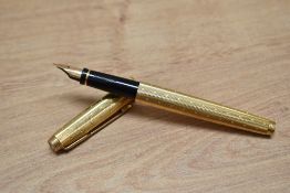 A Parker 75 Perle converter fill fountain pen in rolled gold.
