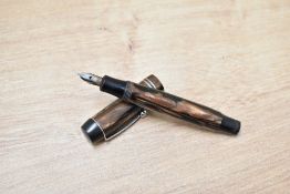 A Platignum Petite button fill fountain pen in black brown having Platignum 1st quality nib