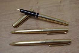 A Pelikan M60 Rolled gold plunger fill fountain pen, ballpoint pen and mechanical pencil set.