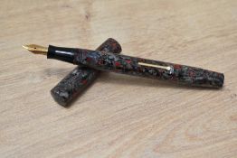 A Mabie Todd & Co Blackbird lever fill fountain pen in red marble with clipless cap having Blackbird