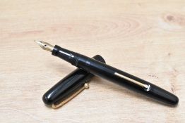 A Mabie Todd & Co Swan 3160 Self Filler Lever Fill fountain pen in black with Swan 1 14ct nib