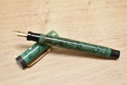 A Parker Duofold Special Lucky Curve button fill fountain pen in jade green with two narrow bands to