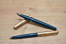 A Parker 61 Custom capillary fill fountain pen, and ballpoint pen set in teal with rolled gold caps.