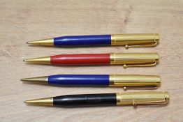 Four Mabie Todd & Co Fyne Poynt propelling pencils with cold tops, two blue, one black and one red