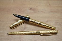A Parker 61 Custom aerometric fill fountain pen and ballpoint pen set in rolled gold cumulus