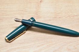 A Parker Slimfold aero fill fountain pen in green with narrow decorative band to the cap having