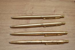 Four Parker Classic rolled gold ballpoint pens in various design