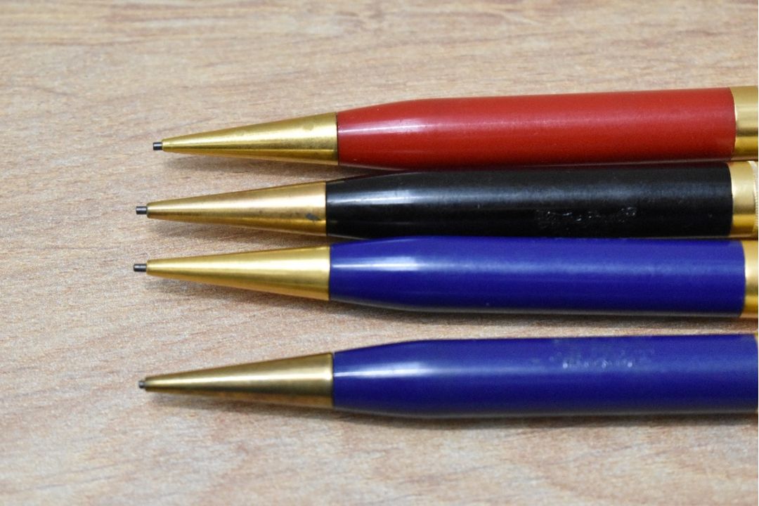 Four Mabie Todd & Co Fyne Poynt propelling pencils with cold tops, two blue, one black and one red - Image 2 of 2