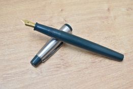 A Platignum cartridge fill fountain pen in green with a brushed steel cap having Platignum Iridium
