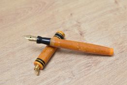 A Mabie Todd Swan 172/51 Self Filling lever fill fountain pen in tangerine with two narrow gold