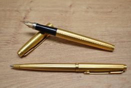 A Parker 75 Grain d'Orge aerometric fill fountain pen and ballpoint pen set in rolled gold.
