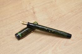 A Parker Duofold Junior Lucky Curve button fill fountain pen in mandarin yellow with two narrow