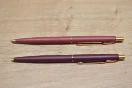 Two Parker Classic ballpoint pens in matte finish. One has crack to top