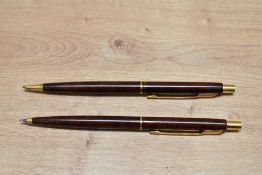 A Parker Classic ballpoint pen and propelling pencil set in Thuya lacque