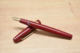 A Mabie Todd & Co Swan Warwick twist fill fountain pen in red having a Swan 3 H 14ct 585 nib.