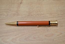 An early Parker Duofold oversize propelling pencil in orange