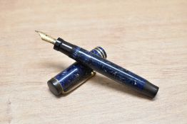 A Parker Duofold Junior button fill fountain pen in lapis lazuli blue with white flecks with two