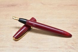 A Mabie Todd & Co Blackbird twist fill fountain pen in burgundy with Blackbird 14ct MT&Co nib