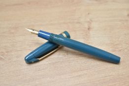 A Mabie Todd & Co Swan Warwick twist fill fountain pen in teal having a Swan 3 H 14ct 585 nib.