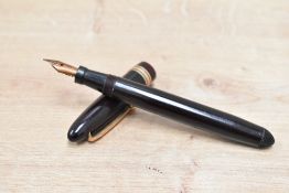 A Mabie Todd & Co Swan 4220 twist fill fountain pen in dark brown having a Swan 2 14ct Mabie