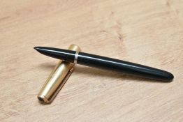 A Parker 51 aerometric fill fountain pen in forest green with rolled gold cap