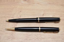 A Parker Duofold ballpoint pen and propelling pencil set in black with narrow decorative band. Boxed
