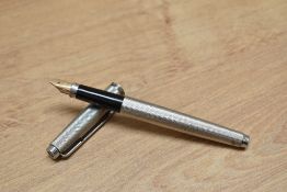 A Parker 75 Grain d'Orge aerometric fill fountain pen in silver fill.