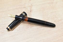 A Montblanc 242G piston fill fountain pen in black having Montblanc 14C 585 nib