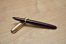 A Parker 51 aerometric fill fountain pen in cordovan brown with rolled gold cap