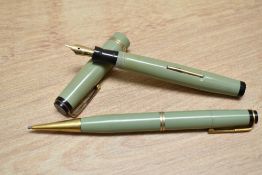 A Mabie Todd & Co Swan Ladies lever fill fountain pen and propelling pencil set in sage green with