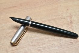 A Parker 51 aerometric fill fountain pen in forest green with rolled silver cap