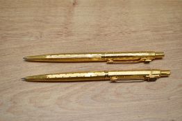 A Parker Classic ballpoint pen and propelling pencil set in rolled gold perle design