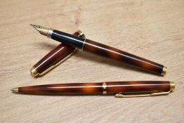 A Parker 75 converter fill fountain pen and ballpoint pen set in thuya lacque.