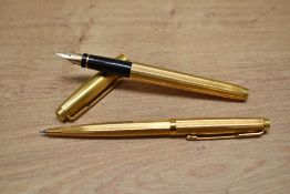 A Parker 75 Godron aerometric fill fountain pen and propelling pencil set in rolled gold.