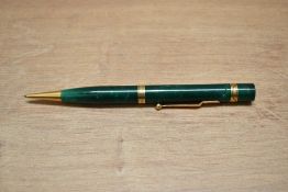 A Mabie Todd Fyne Poynt propelling pencil in dark jade green with two ribbed rings
