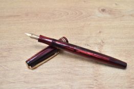 A Mabie Todd & Co Swan Avon button fill fountain pen in black and red having Swan 1 14crt Osmi-