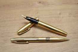 A Sheaffer Imperial 777 aerometric fill fountain pen and propelling pencil set in gold fill with