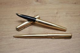 A Parker 61 Custom capillary fill fountain pen and ballpoint pen set in rolled gold.