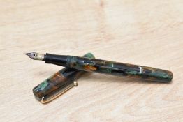 A Mabie Todd & Co Swan SM100/63 self Filler lever fill fountain pen in Russet and Jade having Swan 1