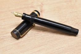 A Parker Duofold Junior button fill fountain pen in black with single band to the cap having