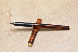 A Parker 180 aerometric fill fountain pen in thuya lacque.