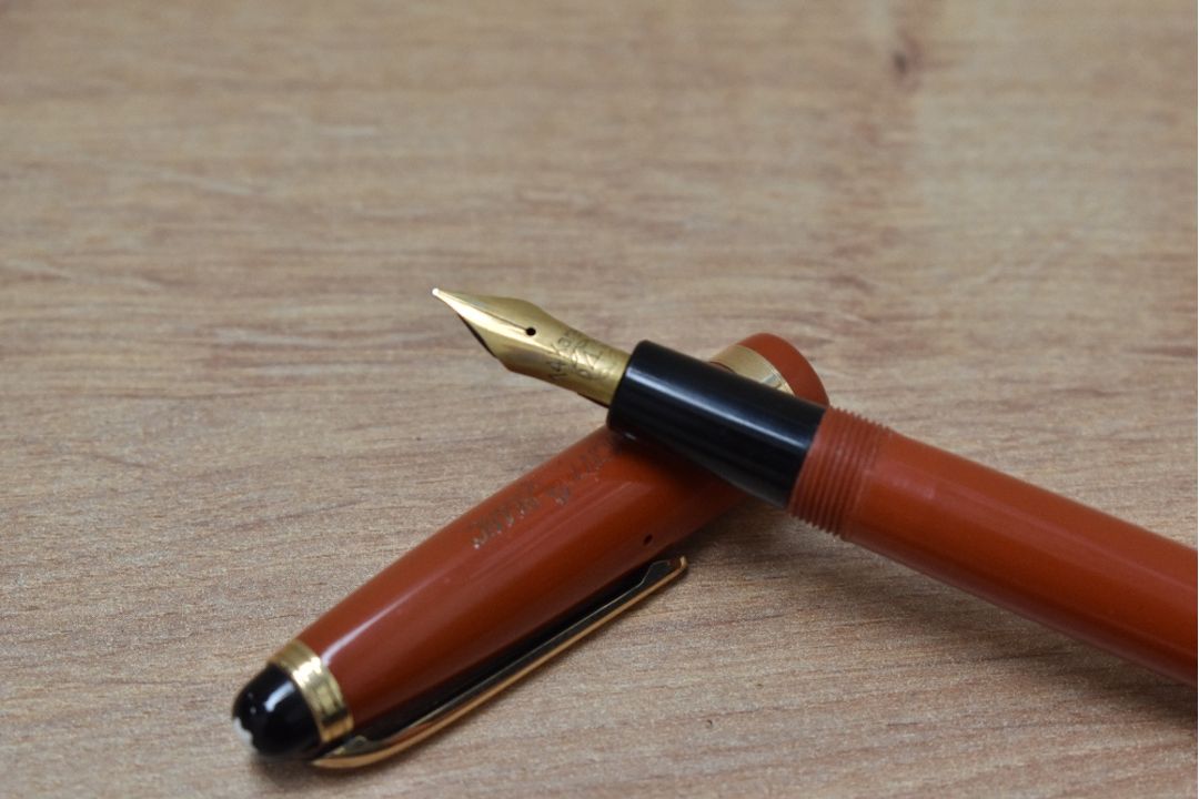 A rare Montblanc 214 button fill fountain pen and propelling pencil in coral red made in Denmark - Image 2 of 3
