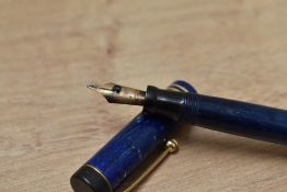 A Parker Duofold Special Lucky Curve button fill fountain pen in lapis lazuli blue with white flecks