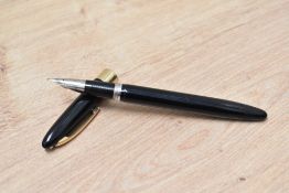 A Sheaffer Statesman snorkel fill fountain pen in black with broad band to white spot cap having