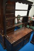 A 19th Century Jacobean style oak dresser having open delft rack, width approx. 122cm