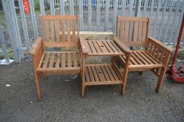 A wooden garden conversation seat