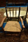 A 19th Century spindle back rush seated carver chair