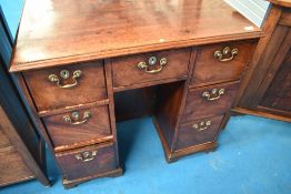 A 19th Century mahogany kneehole desk having heavy brass drop handles , width approx 93cm